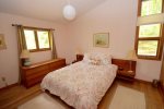 Primary bedroom on main floor with queen bed